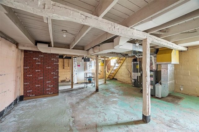 unfinished basement with stairway, water heater, and heating unit