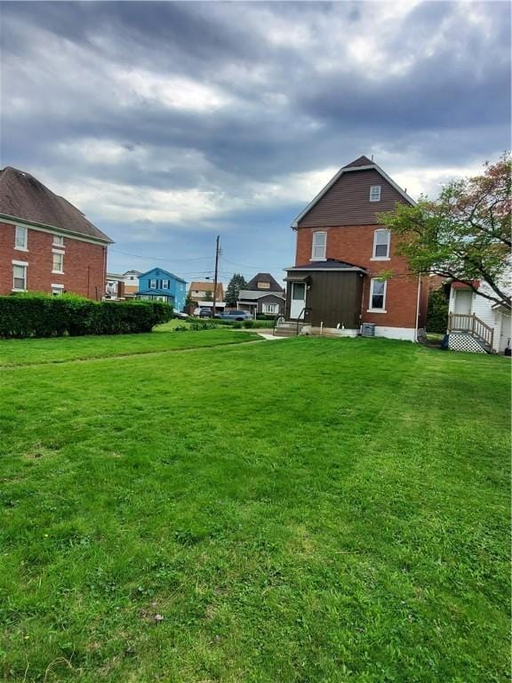 view of yard with entry steps