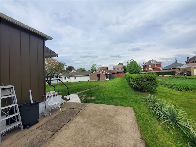 view of yard with a patio area and a residential view