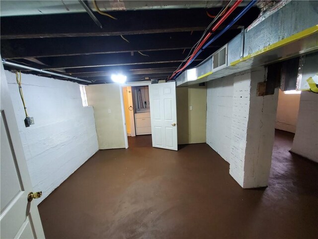 unfinished basement featuring visible vents