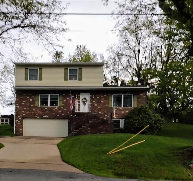 traditional-style home with a garage, concrete driveway, brick siding, and a front lawn