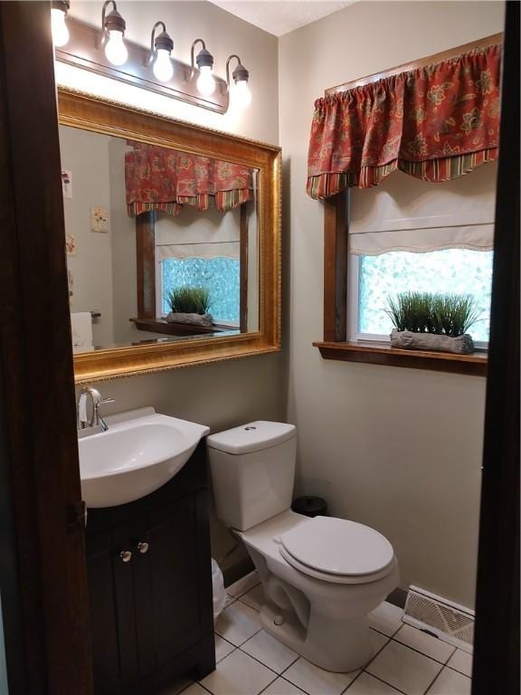 100 Forest Dr, Natrona Hts/Harrison Twp, PA 15065 - bathroom with toilet, tile patterned flooring, and vanity