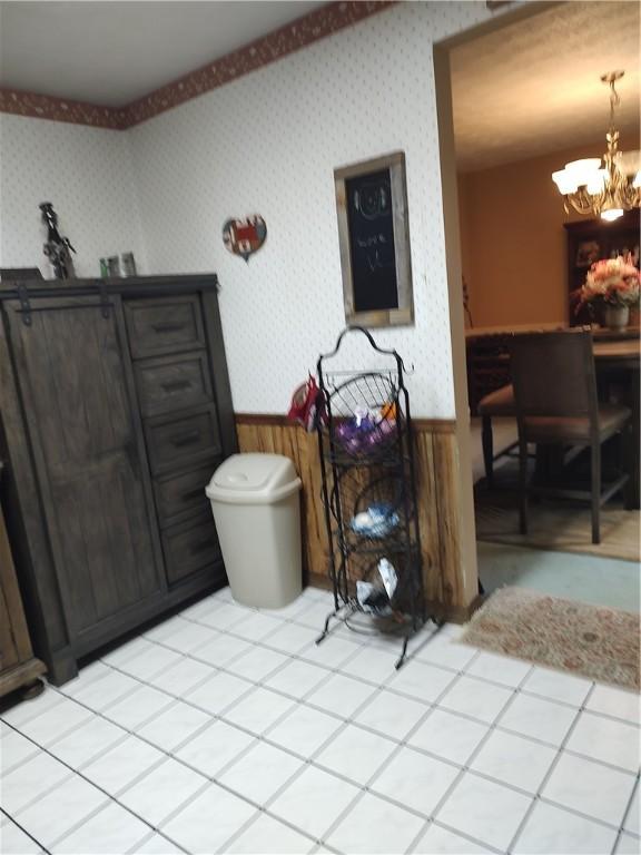 100 Forest Dr, Natrona Hts/Harrison Twp, PA 15065 - dining room with a wainscoted wall, a chandelier, and wallpapered walls