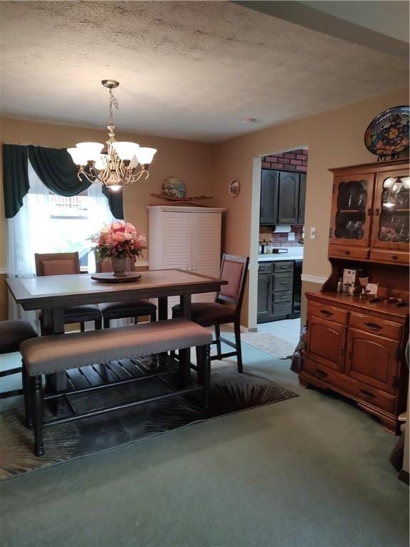 100 Forest Dr, Natrona Hts/Harrison Twp, PA 15065 - dining room with a chandelier, a textured ceiling, and light colored carpet