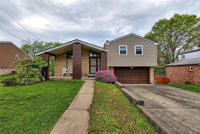 1712 Educational Dr, White Oak, PA 15131 - view of front facade featuring brick siding, concrete driveway, a garage, and a front lawn
