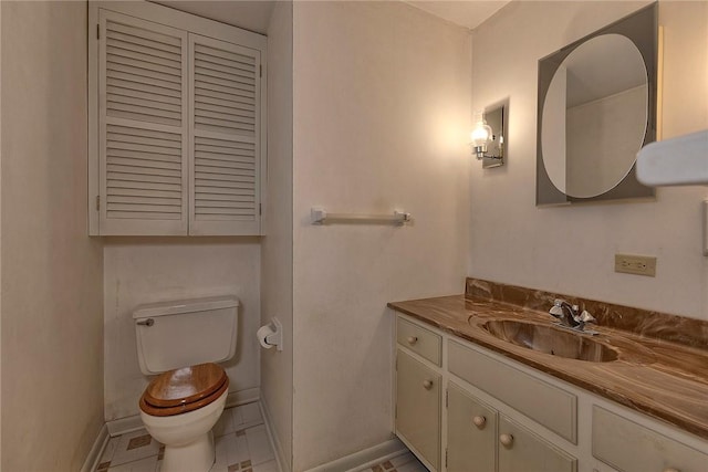 1712 Educational Dr, White Oak, PA 15131 - bathroom featuring toilet, baseboards, and vanity