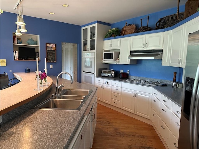 337 Saratoga Dr, South Union Twp, PA 15401 - kitchen featuring under cabinet range hood, stainless steel appliances, white cabinetry, recessed lighting, and dark wood-style floors