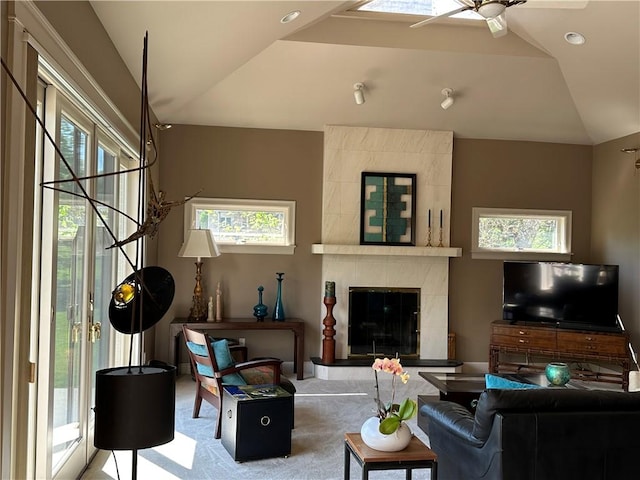 337 Saratoga Dr, South Union Twp, PA 15401 - living area featuring ceiling fan, a tiled fireplace, carpet floors, and vaulted ceiling