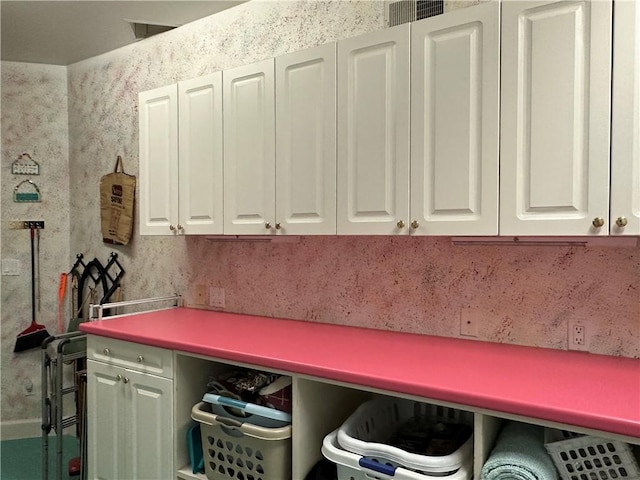 clothes washing area with visible vents