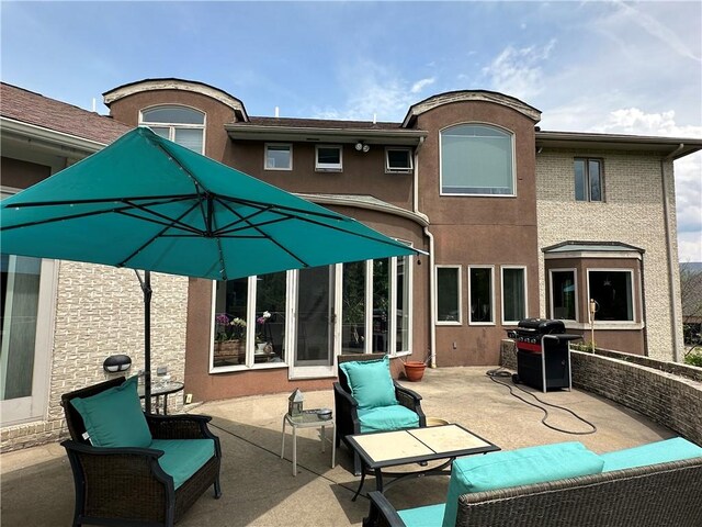 337 Saratoga Dr, South Union Twp, PA 15401 - rear view of property with a patio, an outdoor living space, and stucco siding