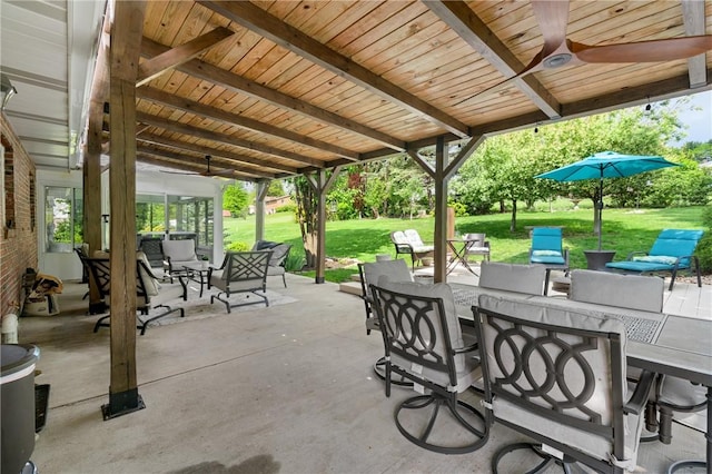 view of patio / terrace with a ceiling fan, outdoor dining area, and an outdoor hangout area