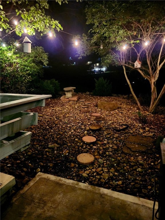 view of yard at twilight