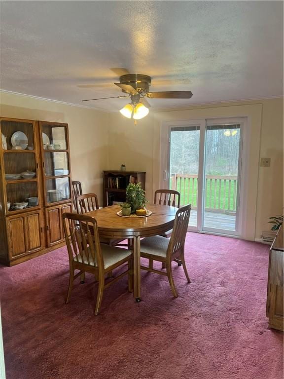 carpeted dining area featuring ceiling fan