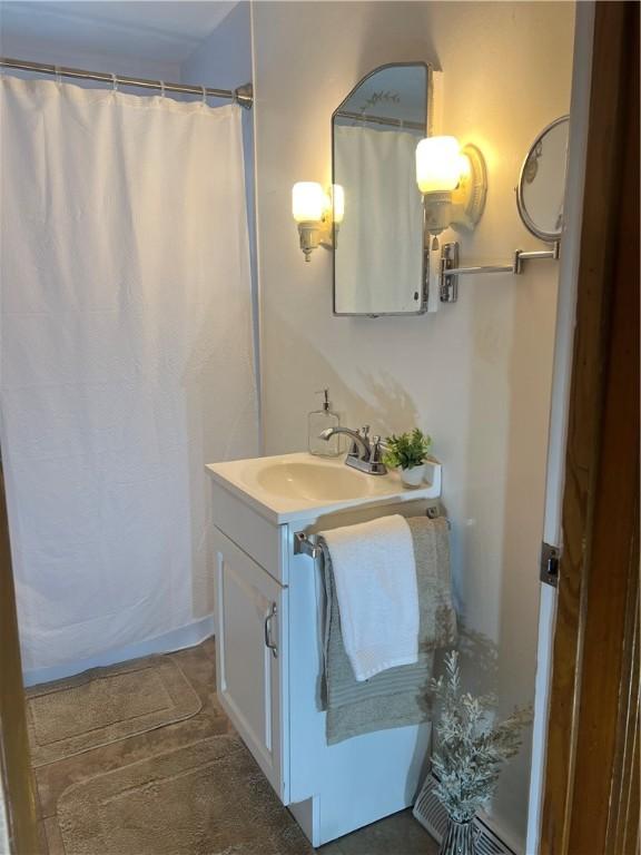 full bath featuring vanity