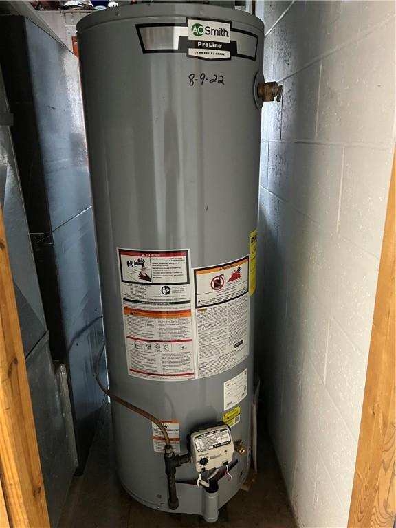 utility room with water heater