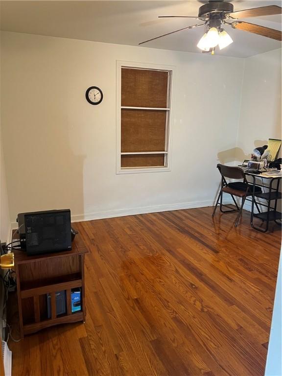 dining area with ceiling fan and wood finished floors