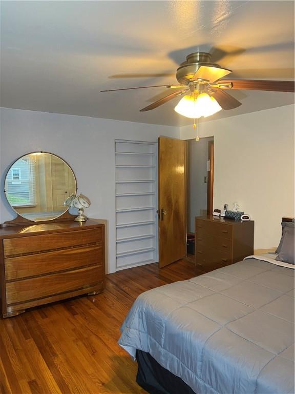 bedroom featuring ceiling fan and wood finished floors
