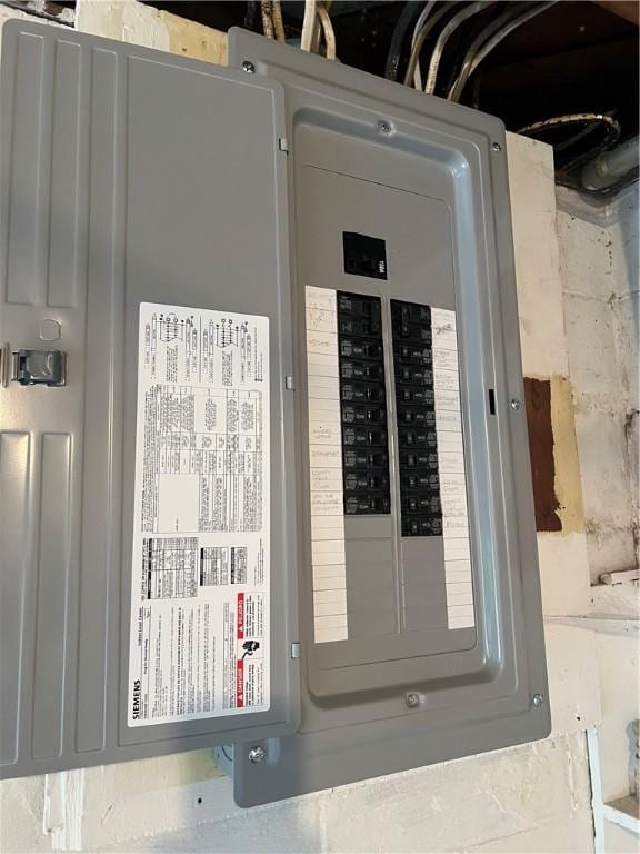 utility room featuring electric panel
