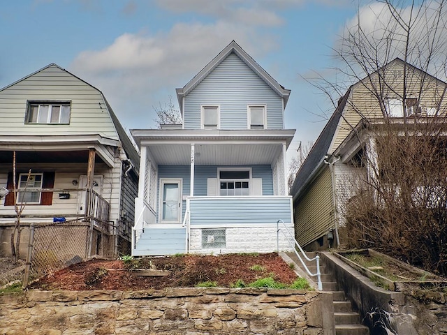 view of front of home with stairway and covered porch