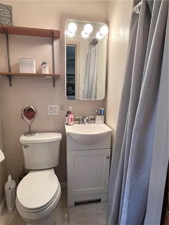440 School St, Indiana Boro Ind, PA 15701 - full bathroom with vanity, tile patterned floors, and toilet