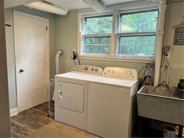 440 School St, Indiana Boro Ind, PA 15701 - laundry room featuring laundry area, wood finished floors, washer and clothes dryer, a sink, and a wealth of natural light
