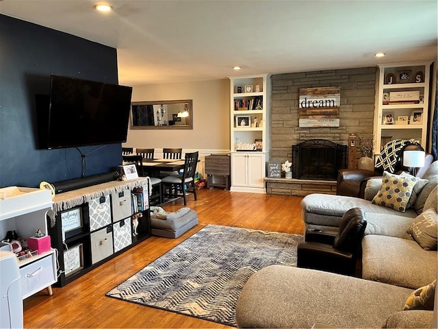 440 School St, Indiana Boro Ind, PA 15701 - living room featuring built in shelves, a fireplace, recessed lighting, and wood finished floors