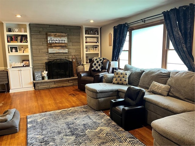 440 School St, Indiana Boro Ind, PA 15701 - living area with a stone fireplace, built in shelves, and hardwood / wood-style floors