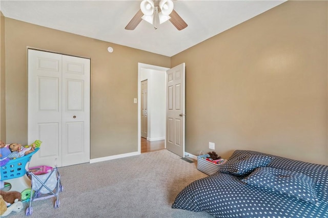carpeted bedroom with baseboards and ceiling fan
