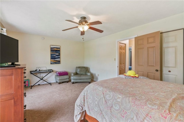 bedroom with baseboards, carpet, and a ceiling fan