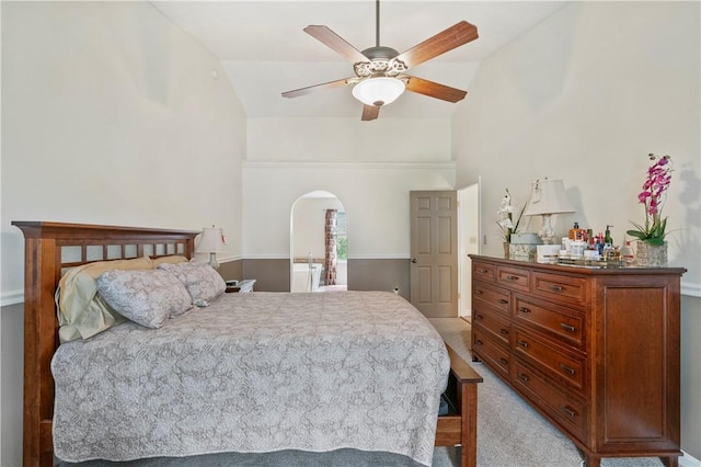 bedroom with carpet flooring, a ceiling fan, and lofted ceiling