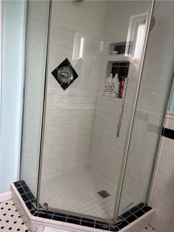 bathroom with a shower stall