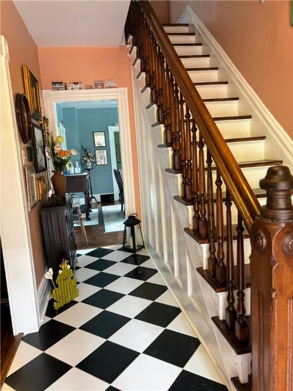 staircase with tile patterned floors