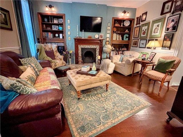 living room with a fireplace and built in shelves
