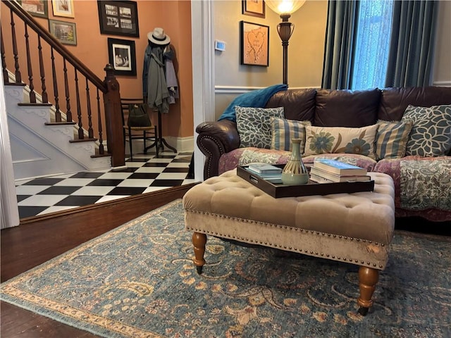 living area featuring stairs and tile patterned floors