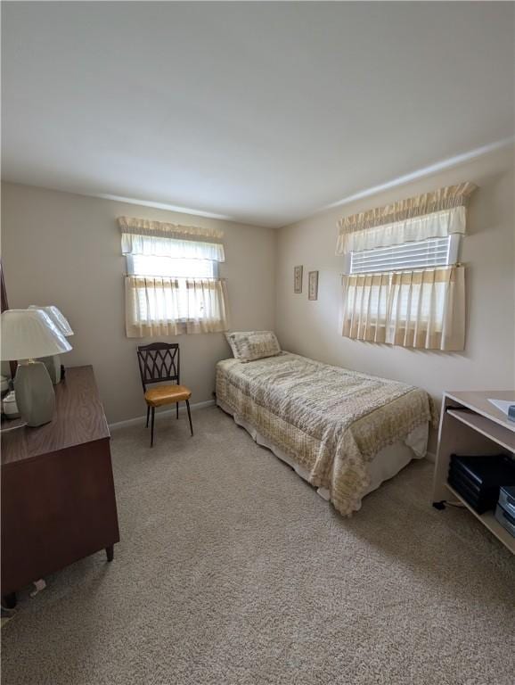 carpeted bedroom with baseboards