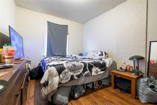 bedroom featuring wood finished floors