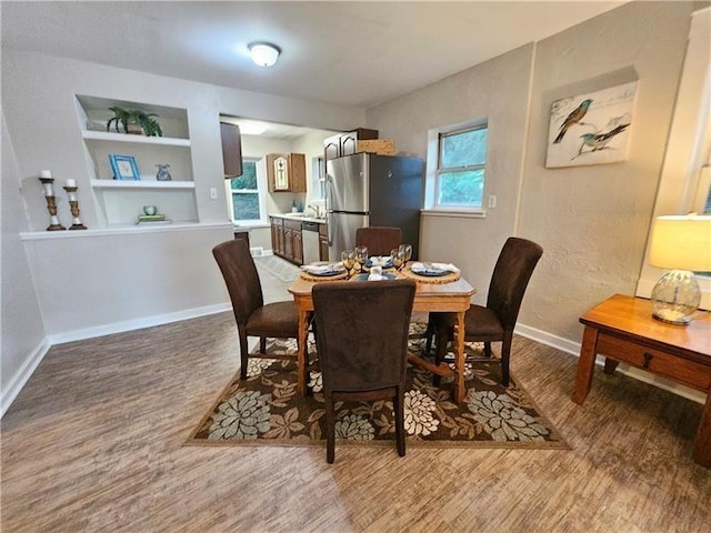 22 Radnor Ave, Forest Hills Boro, PA 15221 - dining space with baseboards, built in features, and wood finished floors