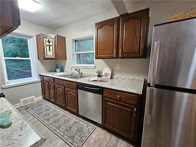 22 Radnor Ave, Forest Hills Boro, PA 15221 - kitchen with visible vents, a sink, light countertops, light wood finished floors, and stainless steel appliances