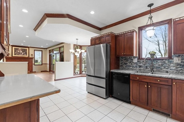5076 Brownsville Rd, Whitehall, PA 15236 - kitchen featuring a sink, a chandelier, black dishwasher, freestanding refrigerator, and visible vents