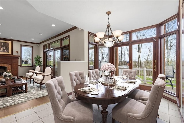 5076 Brownsville Rd, Whitehall, PA 15236 - dining space with recessed lighting, an inviting chandelier, ornamental molding, and light tile patterned floors