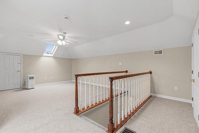 5076 Brownsville Rd, Whitehall, PA 15236 - bonus room with a ceiling fan, visible vents, carpet, and vaulted ceiling with skylight