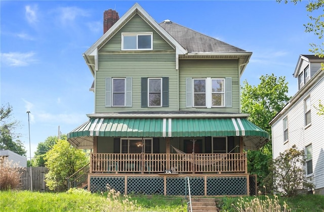 704 E 10th Ave, Munhall, PA 15120 - rear view of property with covered porch and a chimney