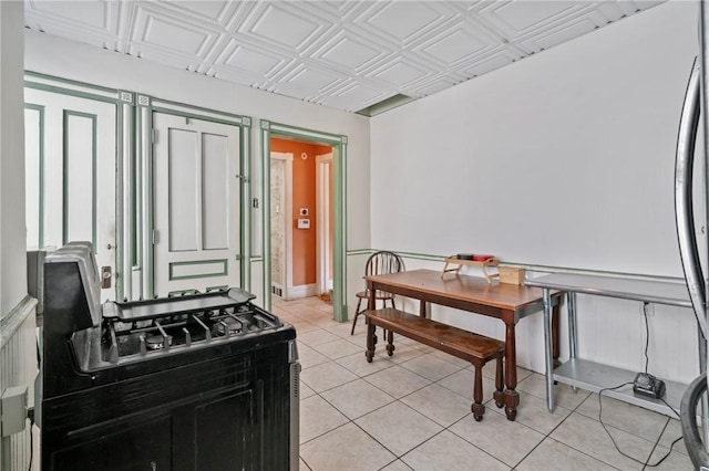 704 E 10th Ave, Munhall, PA 15120 - kitchen with an ornate ceiling and light tile patterned floors