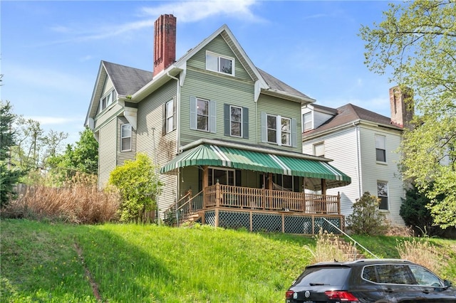 704 E 10th Ave, Munhall, PA 15120 - view of front of property featuring covered porch and a chimney