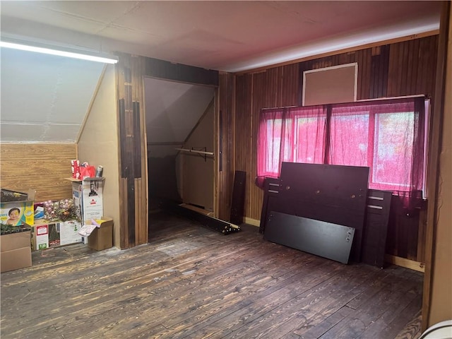 interior space with wooden walls and hardwood / wood-style floors