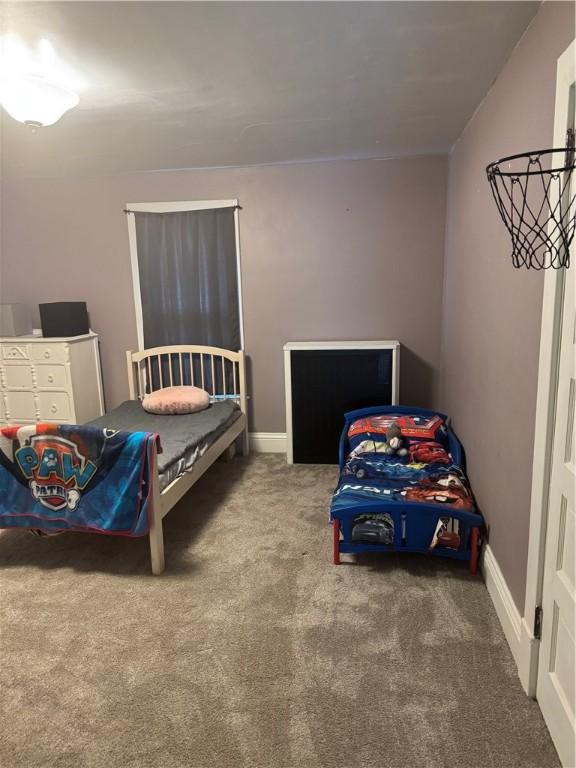 carpeted bedroom with baseboards
