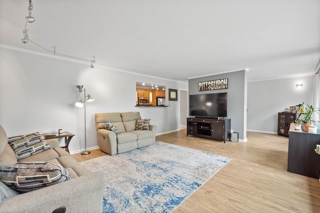 552 N Neville St Unit 26, Oakland, PA 15213 - living room featuring ornamental molding, light wood finished floors, and baseboards
