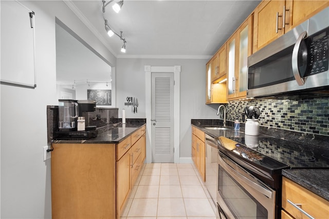 552 N Neville St Unit 26, Oakland, PA 15213 - kitchen featuring appliances with stainless steel finishes, a sink, ornamental molding, backsplash, and glass insert cabinets