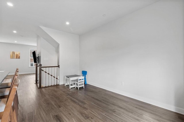 unfurnished room featuring baseboards, recessed lighting, and wood finished floors