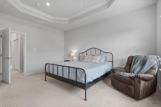 bedroom with baseboards, light carpet, a tray ceiling, and recessed lighting